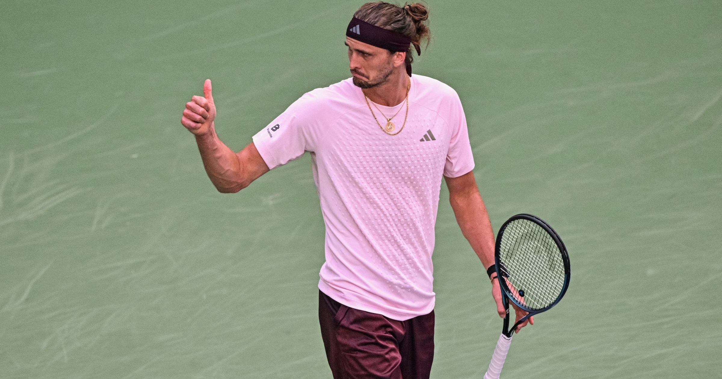 Alexander Zverev advanced to the next round of the Shanghai Masters on Friday, securing a 6:4, 7:6