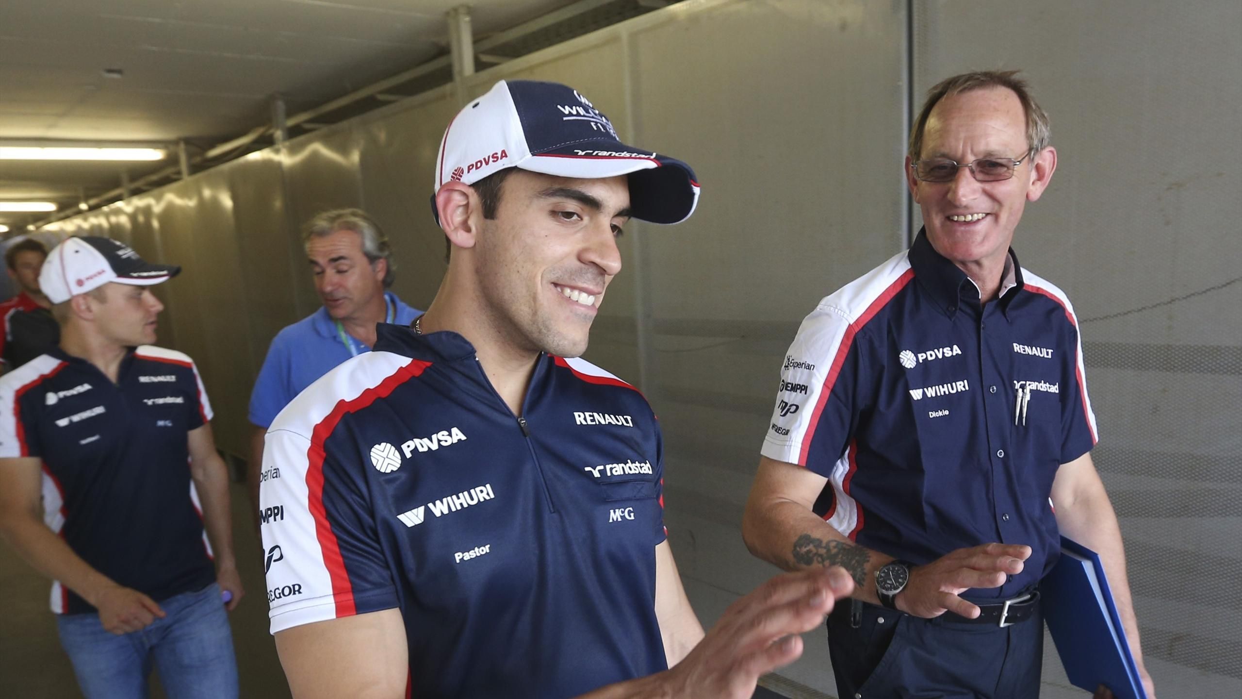 Rubens Barrichello talks to Williams team-mate Pastor Maldonado