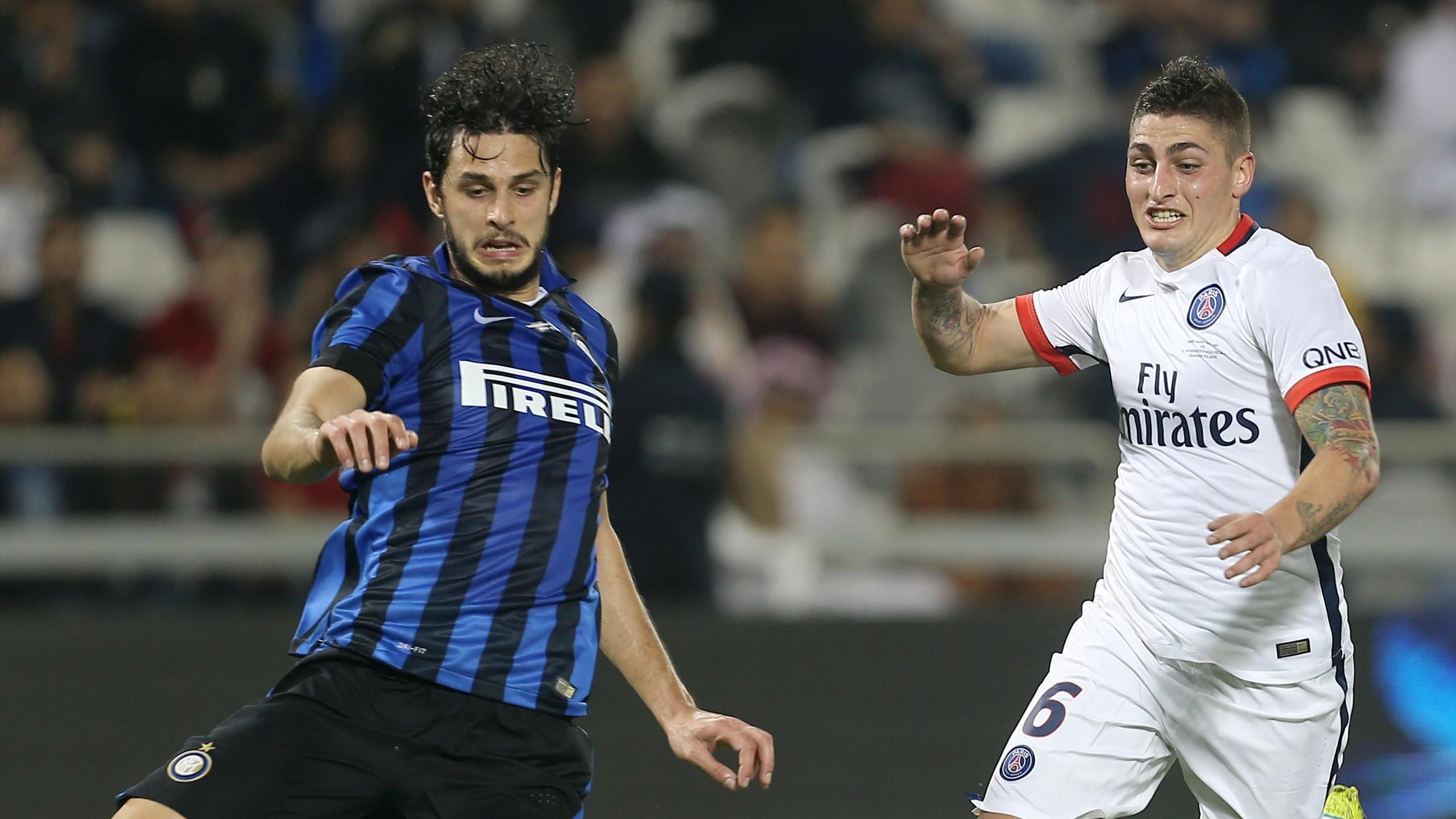 Inter Milan defender Andrea Ranocchia, right, challenges AC Milan