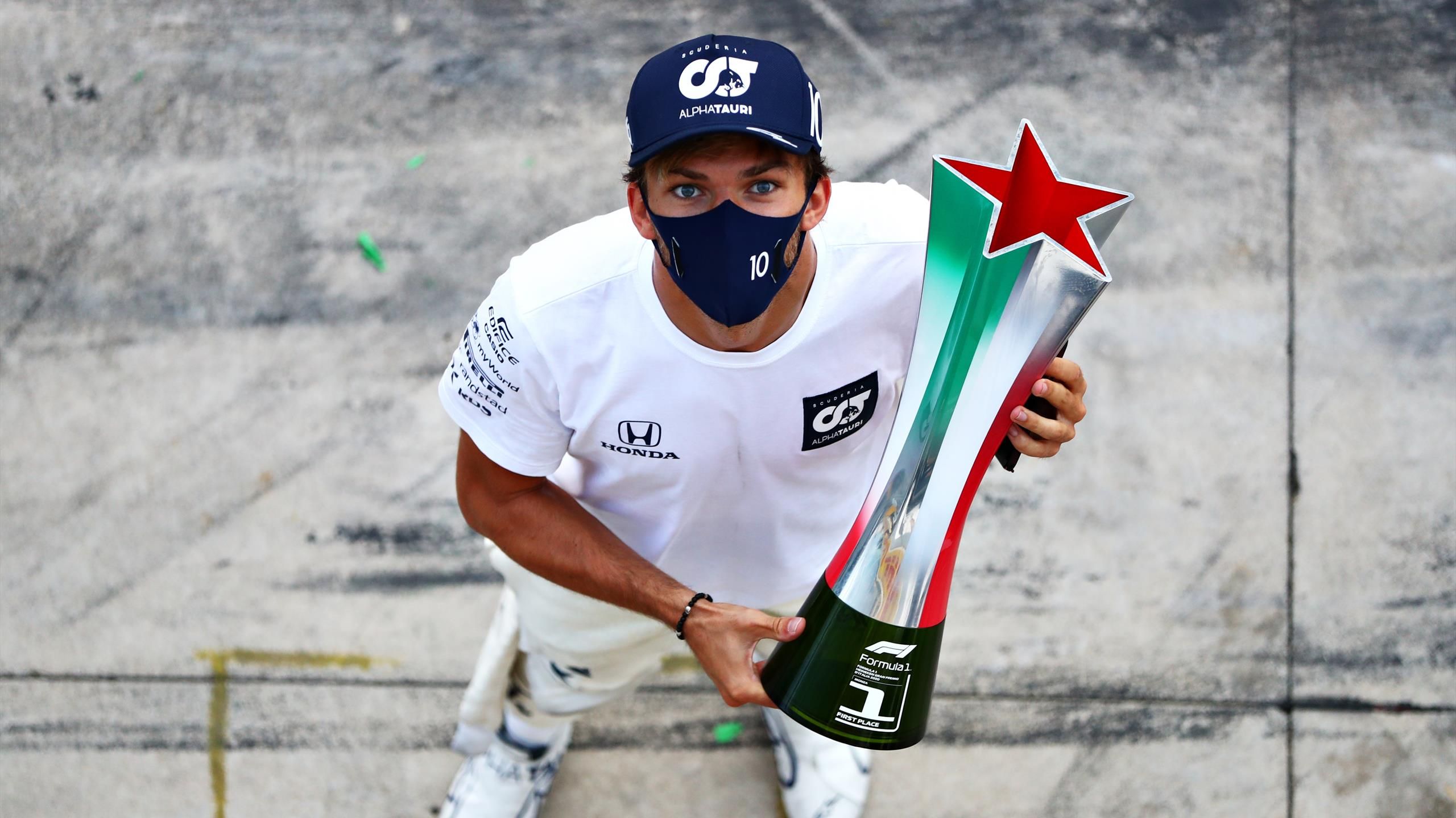 Race winner Pierre Gasly celebrates on the podium with the trophy, Formula  1 photos