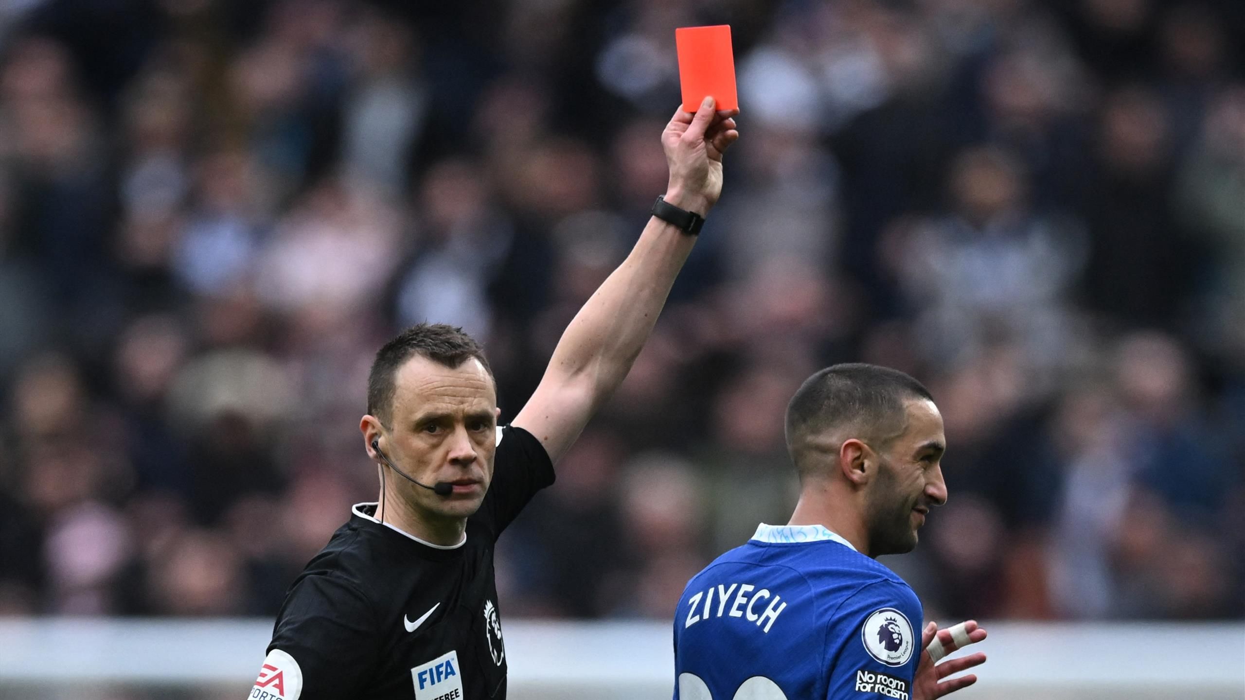 Furious football referee showing a red card Stock Photo