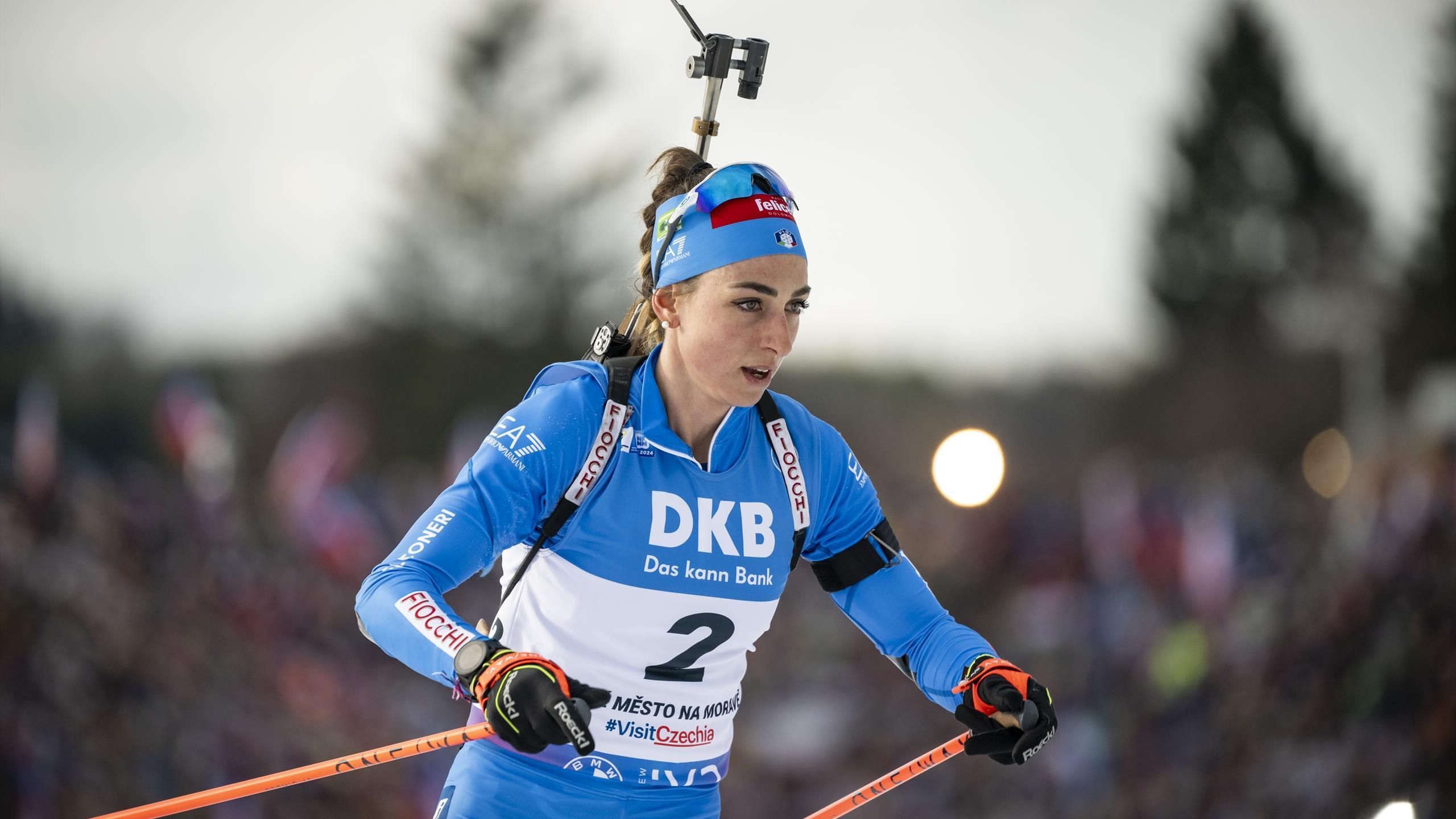 Serene Lisa Vittozzi's Last Standing Heroics Net Milan/cortina Pursuit Gold Wallpaper Illustration