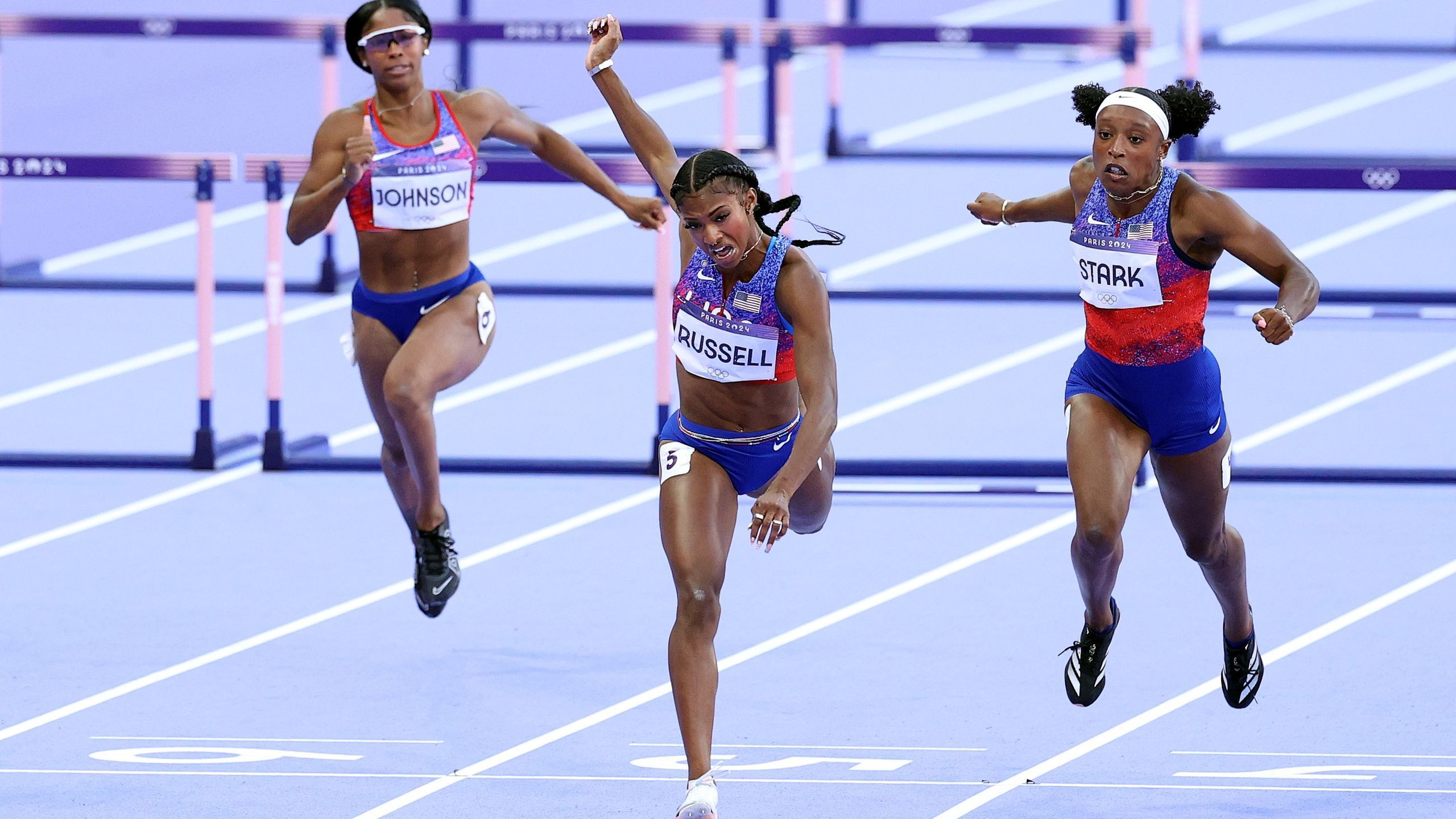 Masai Russell holds off Cyrena SambaMayela, Jasmine CamachoQuinn to