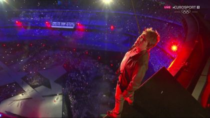 Tom Cruise jumps into the Stade De France at closing ceremony