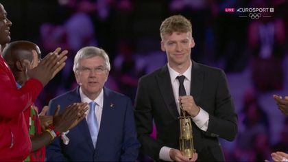 'And the light goes out' - Marchand extinguishes Olympic flame