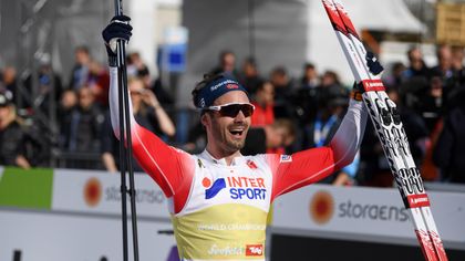 Holund attacks early to win surprise gold in 50km Mass Start