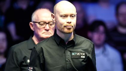 Wilson wins dramatic final frame on respotted black to beat Zhou and reach final