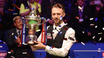 Trump wins first world title with stunning victory over Higgins