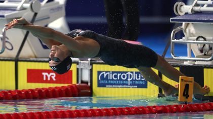 Davies wins third medal with 100m backstroke silver