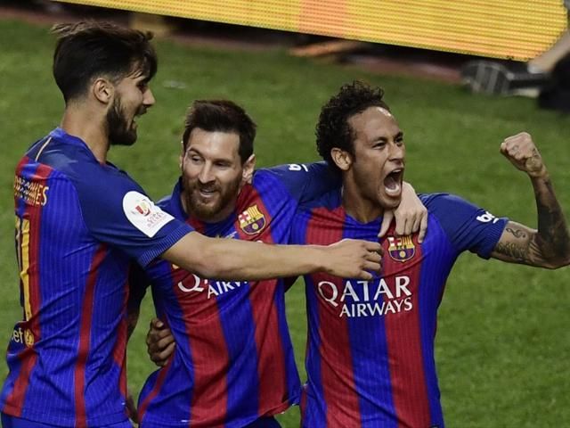 Messi scores three as 10-man Barca holds off Deportivo