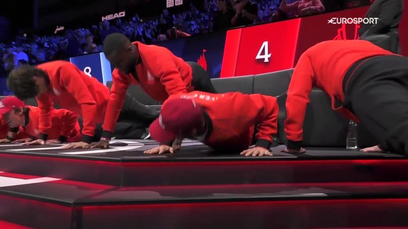 Watch as Team World do press ups on the side of the court to get pumped