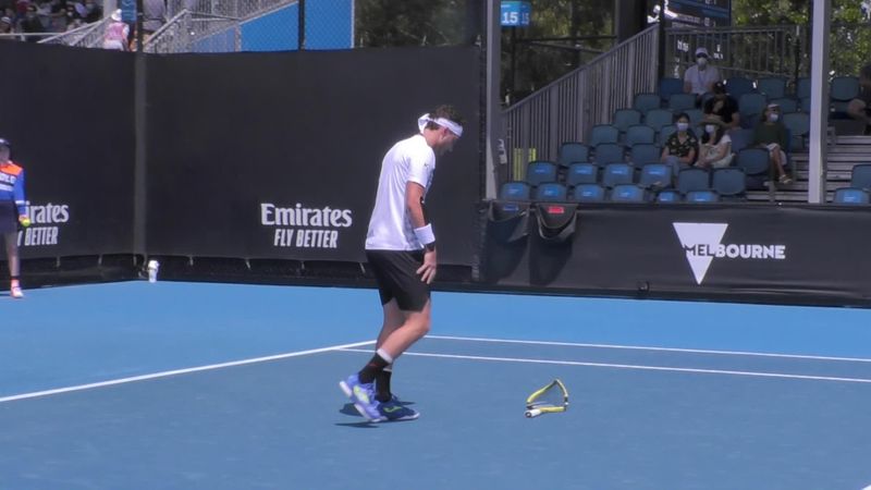 A very frustrated Cecchinato breaks his racket against Kohlschreiber