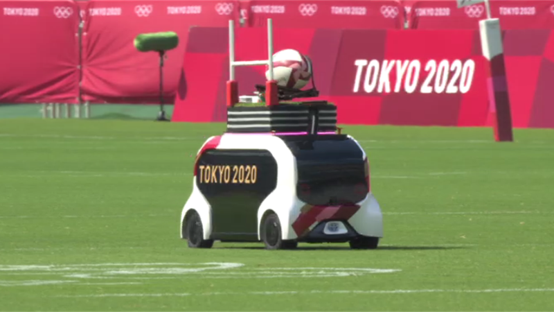 What a robot! Tiny car brings out rugby ball and drops it on pitch